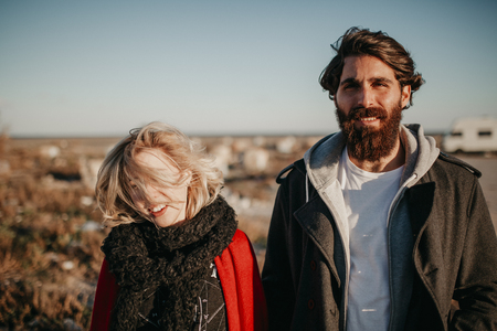 Cool couple enjoying together outdoors in the city suburbs.の写真素材