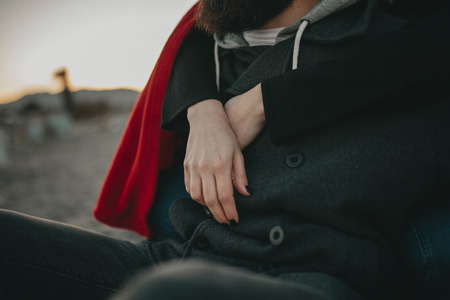 White woman hands embracing her boyfriend.の写真素材