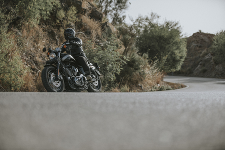 Motorbike turning on a mountain road.の写真素材