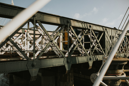 Train bridge iron structure and train going on it.の写真素材