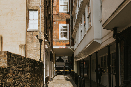 LONDON, ENGLAND - 25th October, 2018: Middle Temple Lane, a narrow classic street, with access from Strand St, during a sunny day, in Westminster city, London, United Kingdomのeditorial素材