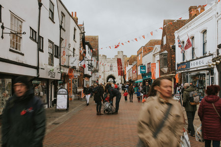 CANTERBURY, ENGLAND - October 28th, 2018: People walking across Canterubury city center in a cloudy day, Kent, English.のeditorial素材