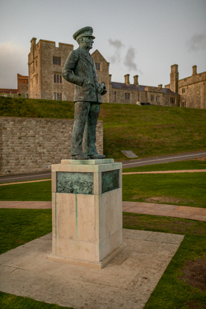 Admiral Sir Bertram Ramsay statue, in front of Dover Castle attached building, during sunset, in Dover, Kent, United Kingdom.のeditorial素材