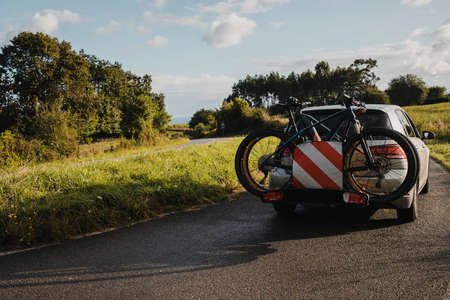 Mountain bikes on a car bike rack. Cycling vacations.の写真素材