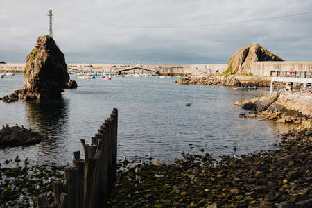 Cudillero, Spain - August 25th, 2020: Seascape of Cudillero village fishing port, in a cloudy day, in the north of Spain, in Asturias.のeditorial素材