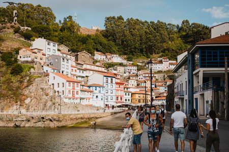 Cudillero, Spain - August 25th, 2020: Cityscape of Cudillero village and fishing port, in the north of Spain. Cudillero is a charming village in Asturias, placed on a hill of the Atlantic coastline, with picturesque architecture and touristic restaurants のeditorial素材