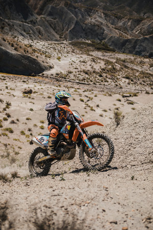 Almeria, Spain - May 5th 2021: Motocross rider riding uphill in Tabernas desert during Dunlop Xperience showroom and test in Almeria, Spain.のeditorial素材