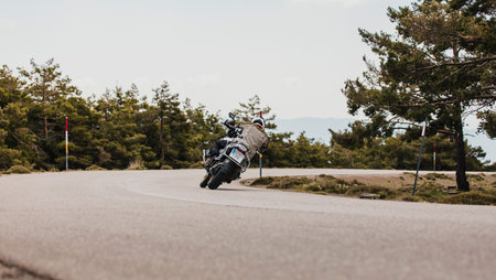 Sierra de los Filabres, Spain - May 5th 2021: Motorbike rider riding BMW R 1250 GS motorcycle in a mountain road across beautiful turns, during Dunlop Xperience event in Sierra de los Filabres, Spain.のeditorial素材