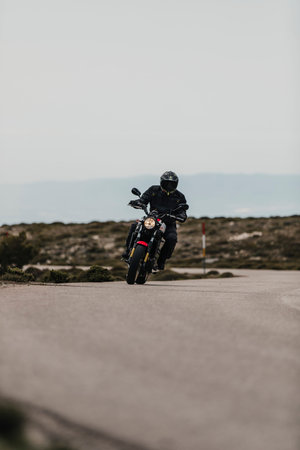 Calar Alto, Spain - May 5th 2021: Man riding a Yamaha XSR700 motorcycle in a beautiful mountain...