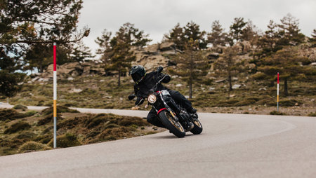 Calar Alto, Spain - May 5th 2021: Man riding a Yamaha XSR700 motorcycle in a beautiful road, during...