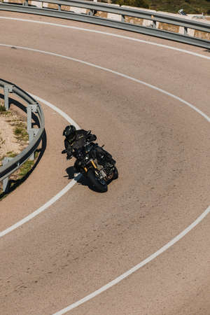 Almeria, Spain - May 5th 2021: Man riding a Yamaha Hyper Naked MT10 motorcycle in a beautiful mountain range road, during Dunlop Xperience event in Almeria, Spain.のeditorial素材