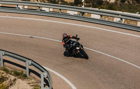 Almeria, Spain - May 5th 2021: Man riding a BMW S 1000 R motorcycle in a mountain road, during Dunlop Xperience event in Almeria, Spain.のeditorial素材