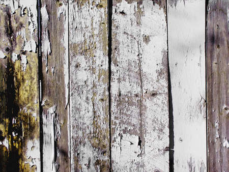 old white fence with peeling paintの写真素材