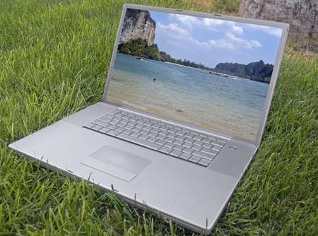 laptop in the grassの写真素材