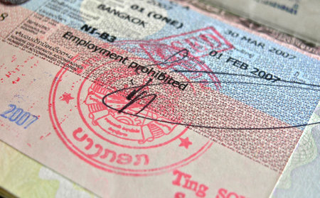 closeup of a lao visa in a british passportの写真素材