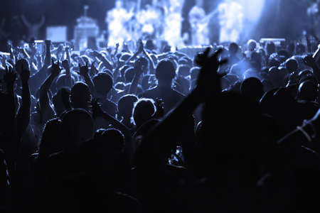 An Audience cheering for their favorite musicianの写真素材