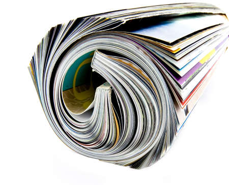 rolled up magazine on whiteの写真素材