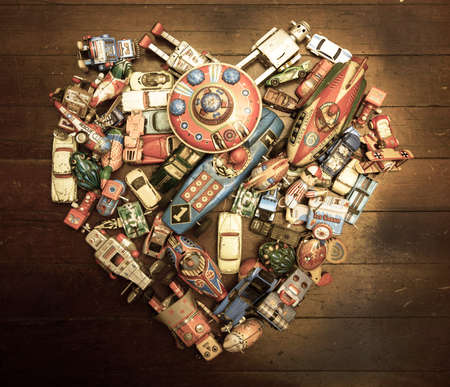 a large colection of tin toys in a heart shapeの写真素材