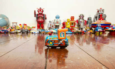 small  tin toy train on wooden floorの写真素材
