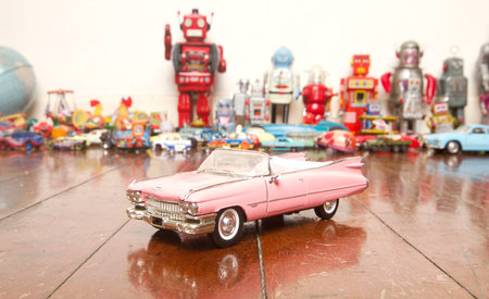 classic pink car  toy on wooden floor