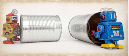 retro robot and old tin can with string (phone concept)の写真素材