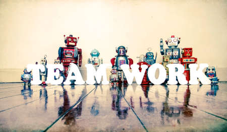 Retro robots spell out TEAM WORK   with reflectiona toned co;or image の写真素材