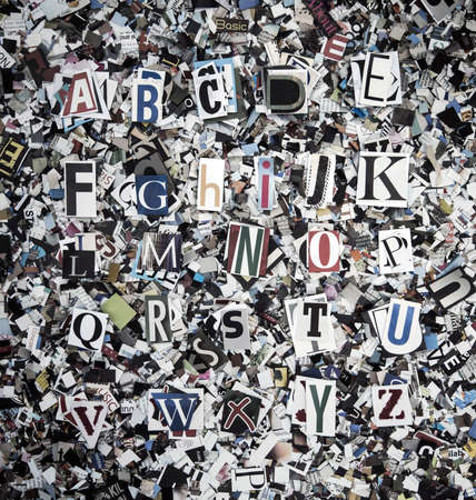 A  random  selection of word cut out from old magazines   with confettiの写真素材