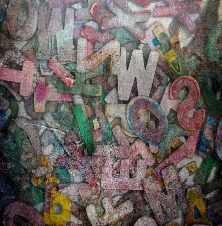 random wooden letters dirty grunge backgroundの写真素材