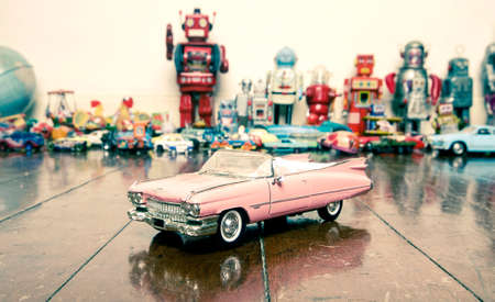 classic pink car, toy on wooden floorの写真素材