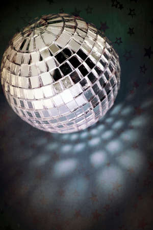 retro disco ball with stars and night sky blue backgroundの写真素材