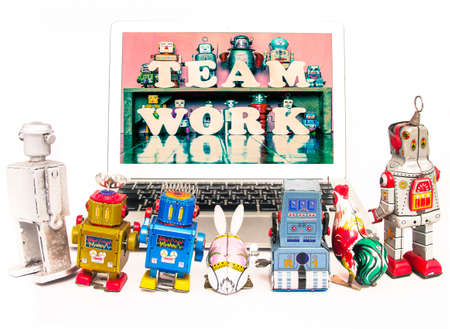 robot kids learn about team work on a laptopの写真素材
