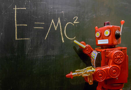 retro red robot techer at a blacboard with a ray gun,の写真素材