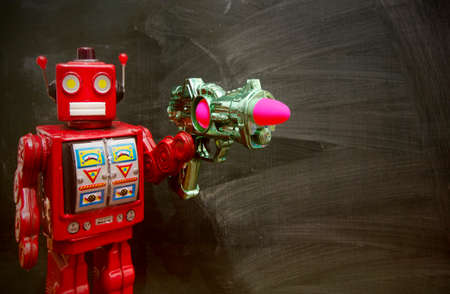 retro red robot techer at a blacboard with a ray gunの写真素材