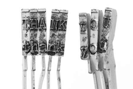 The word Thank you with old typewriter hammers macro image の写真素材