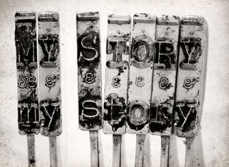 The words  MY STORY  with old typewriter hammers macro image on old paper の写真素材