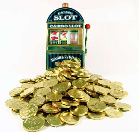 retro toy slot macjine with lots of gold winningsの写真素材