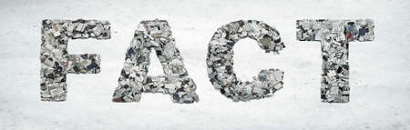 the word FACT made from newspaper confetti  on old paperの写真素材