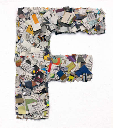 Letters made from newspaper capitel F isolated on whiteの写真素材