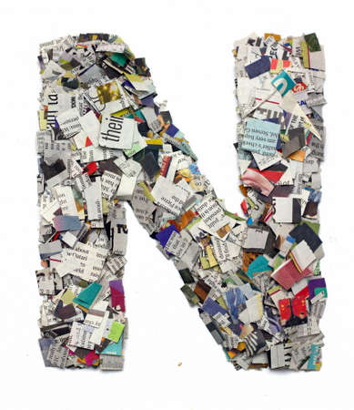 Letters made from newspaper capitel N isolated on whiteの写真素材