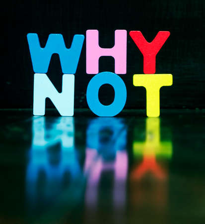 the wors WHY NOT with wooden letters and reflection  black backgroundの写真素材