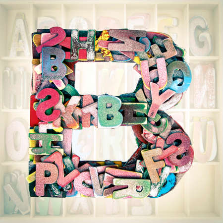 lots of small wooden letters to make up the letter Bの写真素材