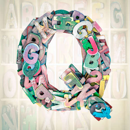 lots of small wooden letters to make up the letter Qの写真素材