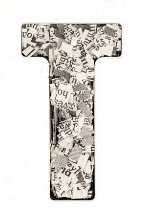 Capital letter made from cut up old newspaper Macro photographyの写真素材