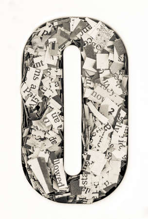 Capital letter made from cut up old newspaper Macro photographyの写真素材