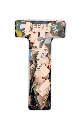 financial news  newspaper cut up into confetti  to make  the captal letter T