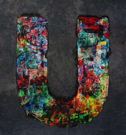 lots of small wooden letters to make up the letter A  graffiti style on a dark textured backgroundの写真素材