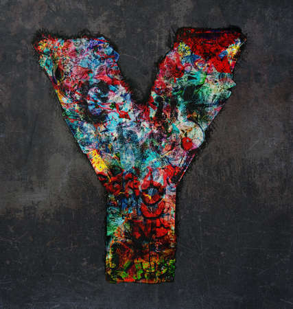 lots of small wooden letters to make up the letter A  graffiti style on a dark textured backgroundの写真素材