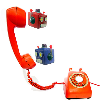 two robot head on a old phone isolated