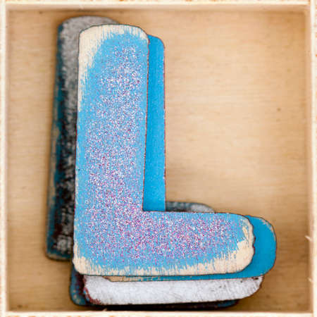 old wooden letter  Lin a box shot from above macro imageの写真素材