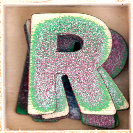 old wooden letter  R in a box shot from above macro imageの写真素材